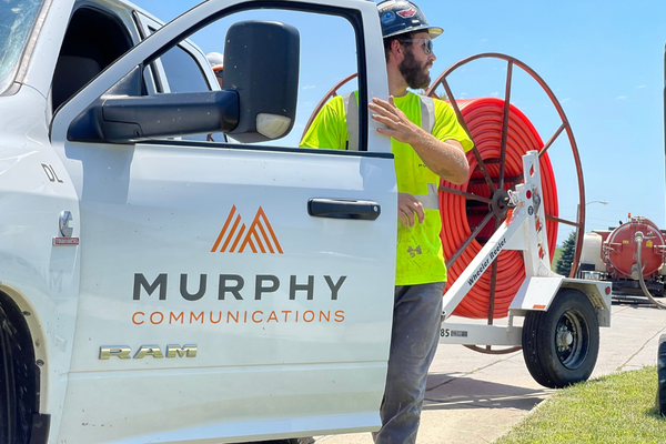 Murphy Communications truck and worker.