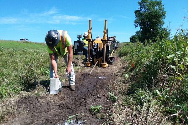 Murphy Communications worker performing optical fiber work.